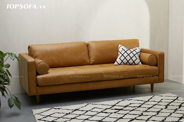 Phần đệm sofa TS322 nhấn lỗ trang trí để tạo ma sát và nổi bật sự êm ái. Hai bên tay vịn có hai phần gối đệm tròn, dài vừa như một điểm nhấn trang trí vừa là tay tựa êm ái cho người ngồi. Cùng với đó là chất liệu da màu vàng da bò cũng nâng tầng đẳng cấp cho sofa