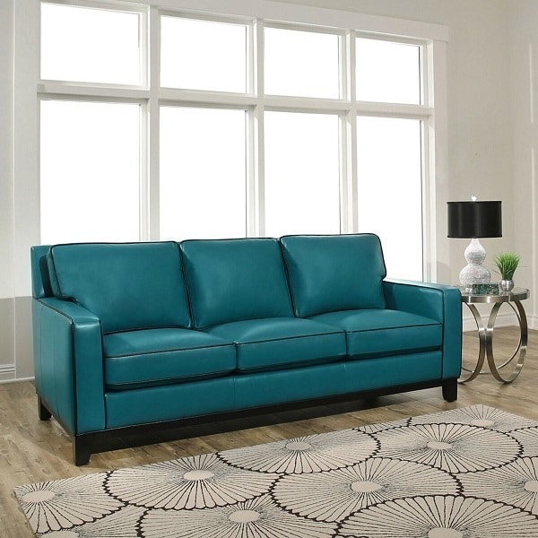 Sofa văng da trơn loại 3 chỗ màu xanh cổ vịt đang được rất ưa chuộng trong trang trí nội thất bởi màu cổ vịt là gam màu không lộ bụi bẩn, phù hợp với không gian gia đình. Thiết kế đơn giản rất dễ thích nghi mà không hề kén không gian.