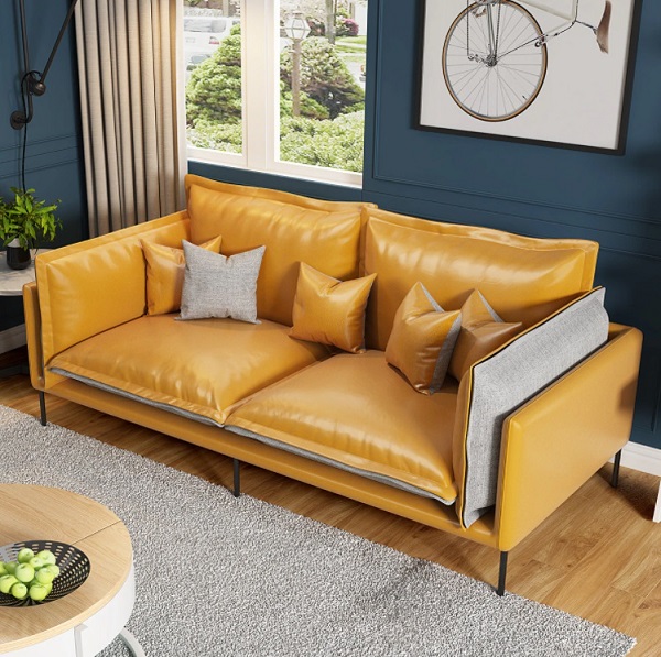 Một chiếc ghế sofa văng da – vải phối màu cam vàng – xám nhạt thế này sẽ là sự lựa chọn hoàn hảo để kê sát mép tường phòng ngủ màu xanh ghi